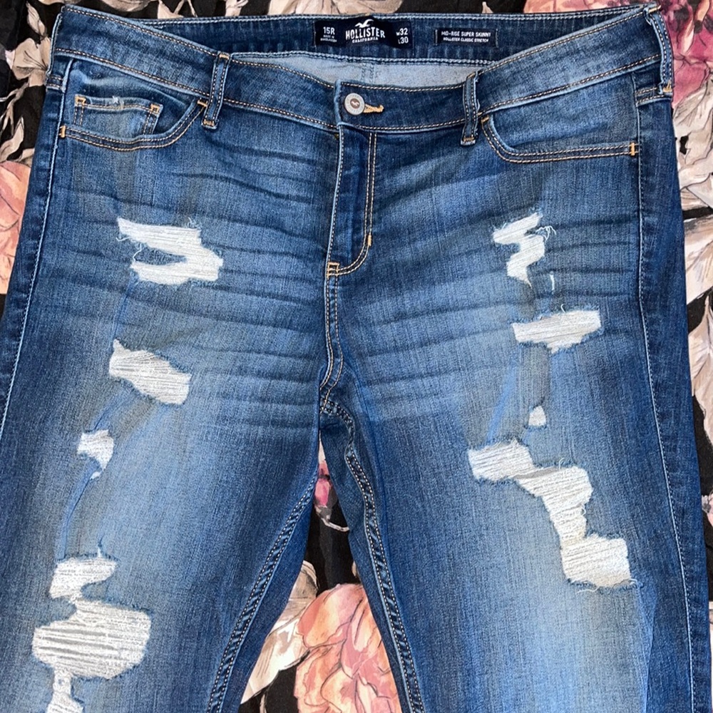Distressed mid rise super skinny jeans